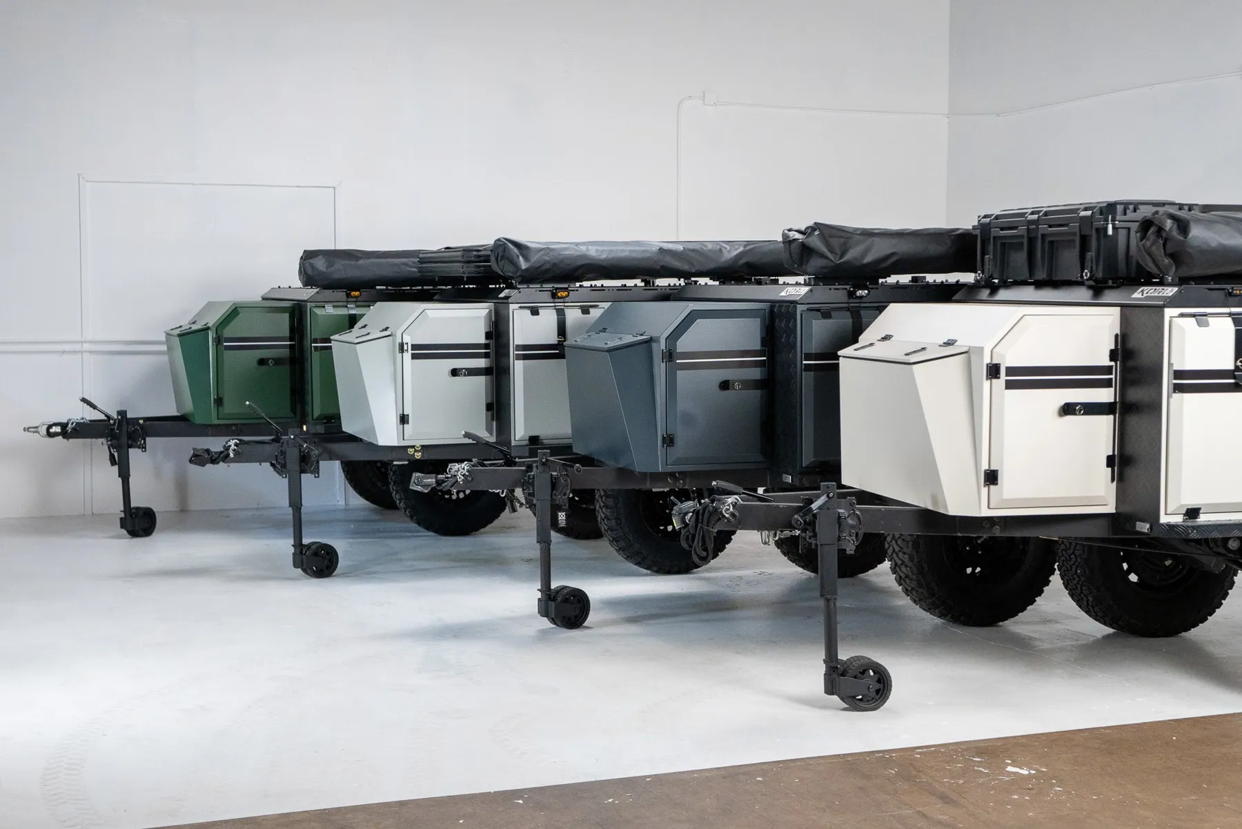 Off-road response trailers lined up in a showroom